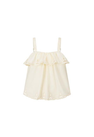 A cream-colored eyelet lace top with thin shoulder straps and a ruffled neckline, displayed against a solid white background.