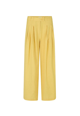 a-pair-of-wide-leg-cropped-trousers-in-a-soft-mustard-yellow-featuring-pleated-detailing-down-the-front-of-the-legs-and-a-button-closure-at-the-waistband-shown-against-a-plain-white-background
