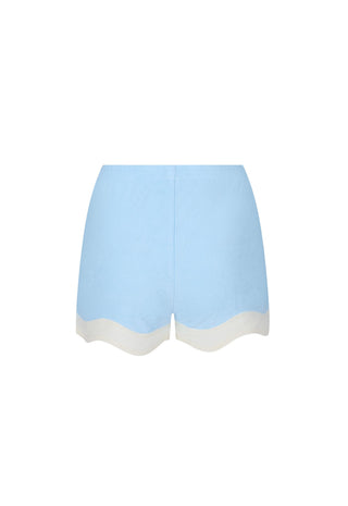 light-blue-shorts-with-a-contrasting-off-white-scalloped-hem-shown-flat-against-a-white-background