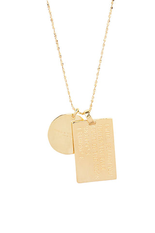 close-up-back-view-of-spell-s-aquarius-stargazer-zodiac-necklace-charms-one-charm-is-of-a-rectangular-shape-and-an-inspirational-quote-while-the-other-charm-is-circular-the-brand-name